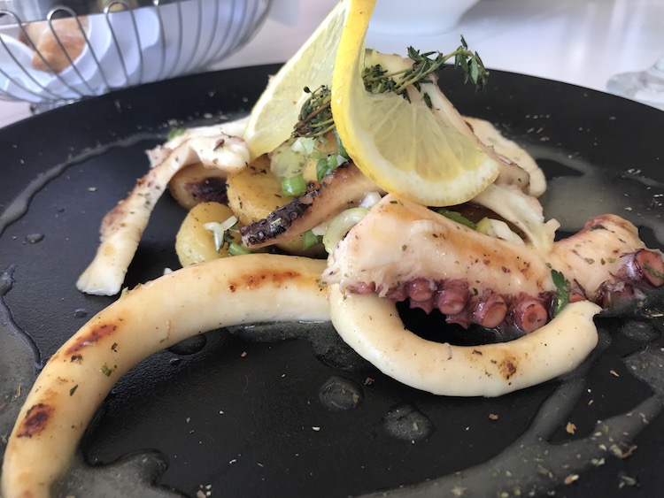 grilled octopus enjoyed in a local taverna on a greek island hopping cruise by Celestyal Cruises