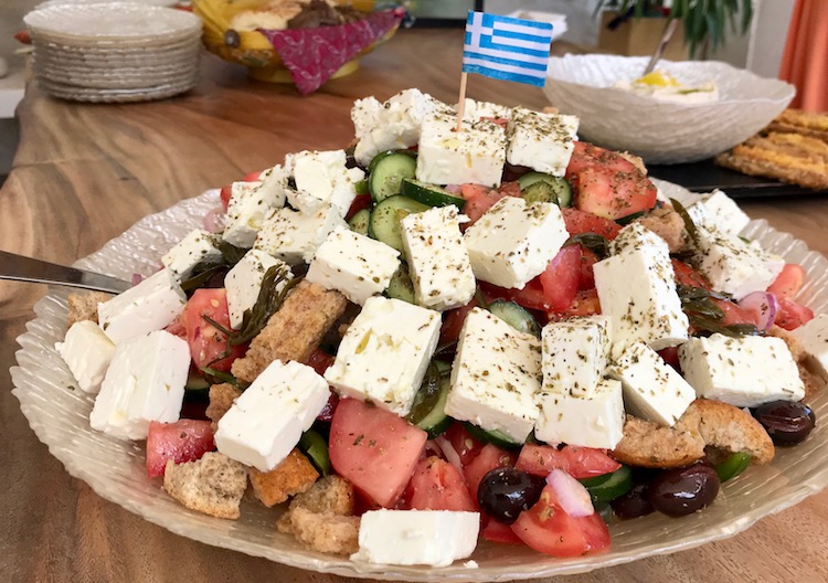 greek salad with feta, olives, and tomatoes served at lunch during a greek island cruise