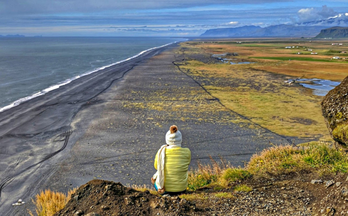 Packing for Iceland. Looking at black beach.