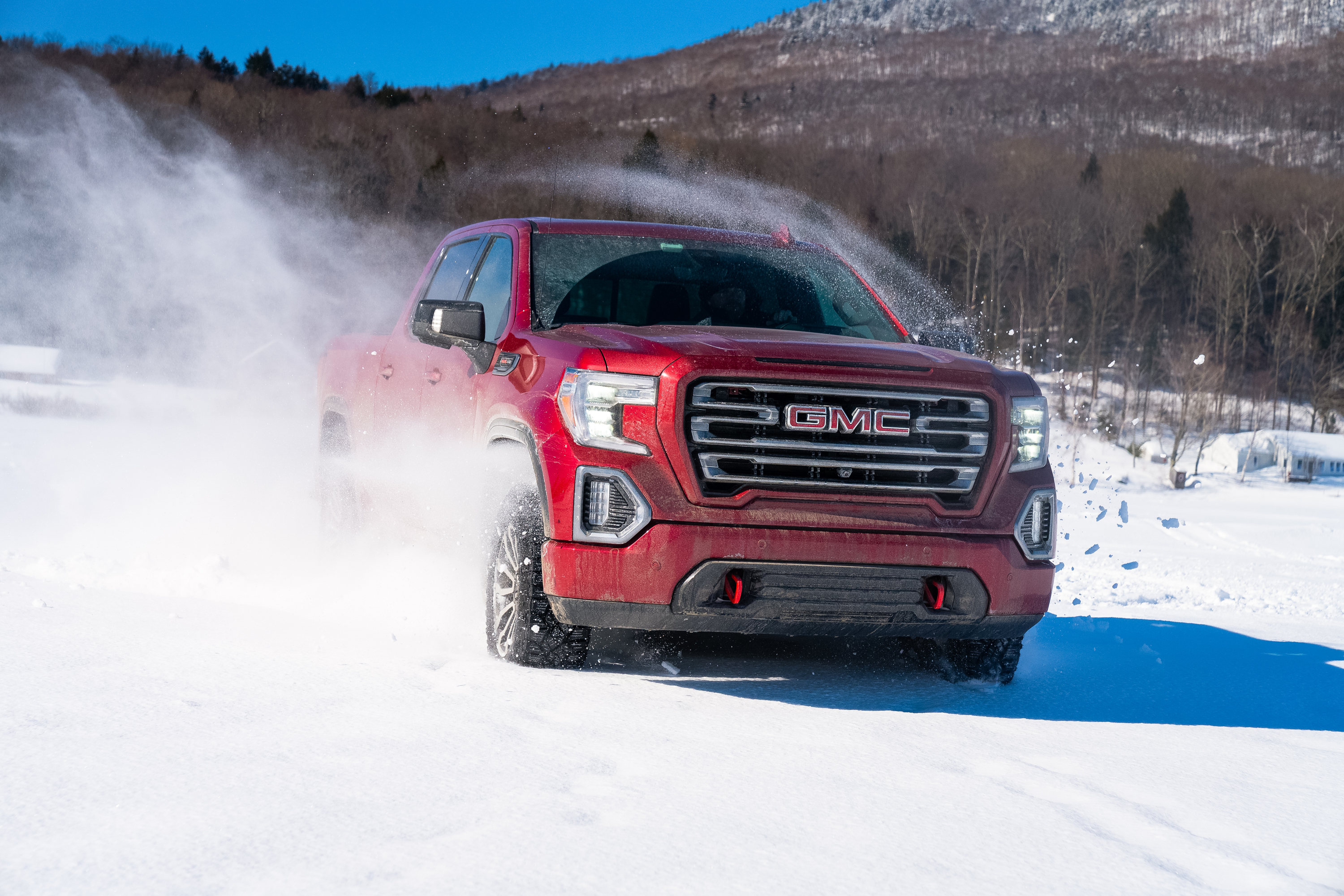Winter driving tips: try a Red GMC Sierra on snow covered lake in Stowe VT
