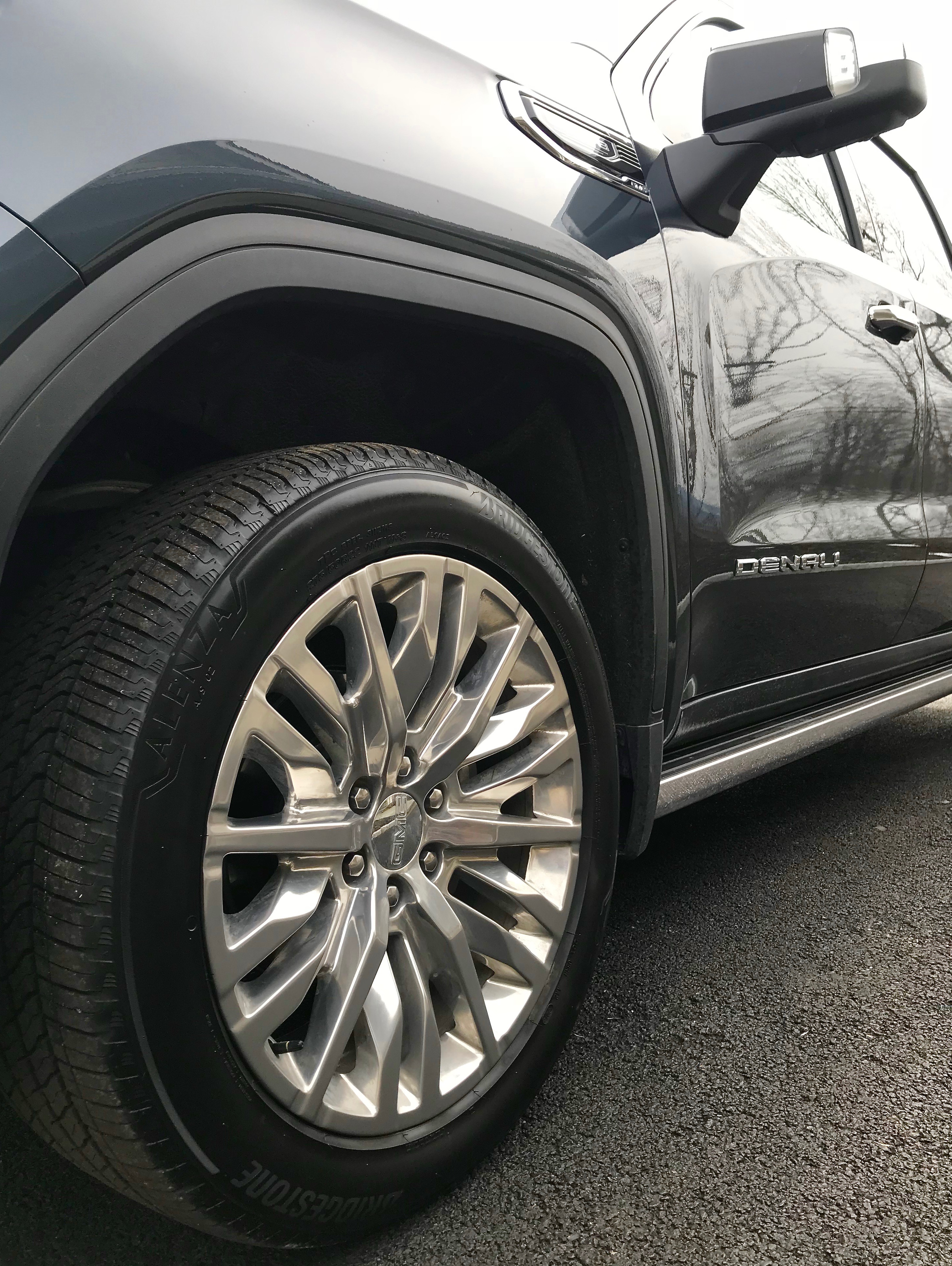 One of my favorite winter driving tips: performance tires with sculpted rims on GMC Sierra Denali - having the right tires is an important winter driving tip
