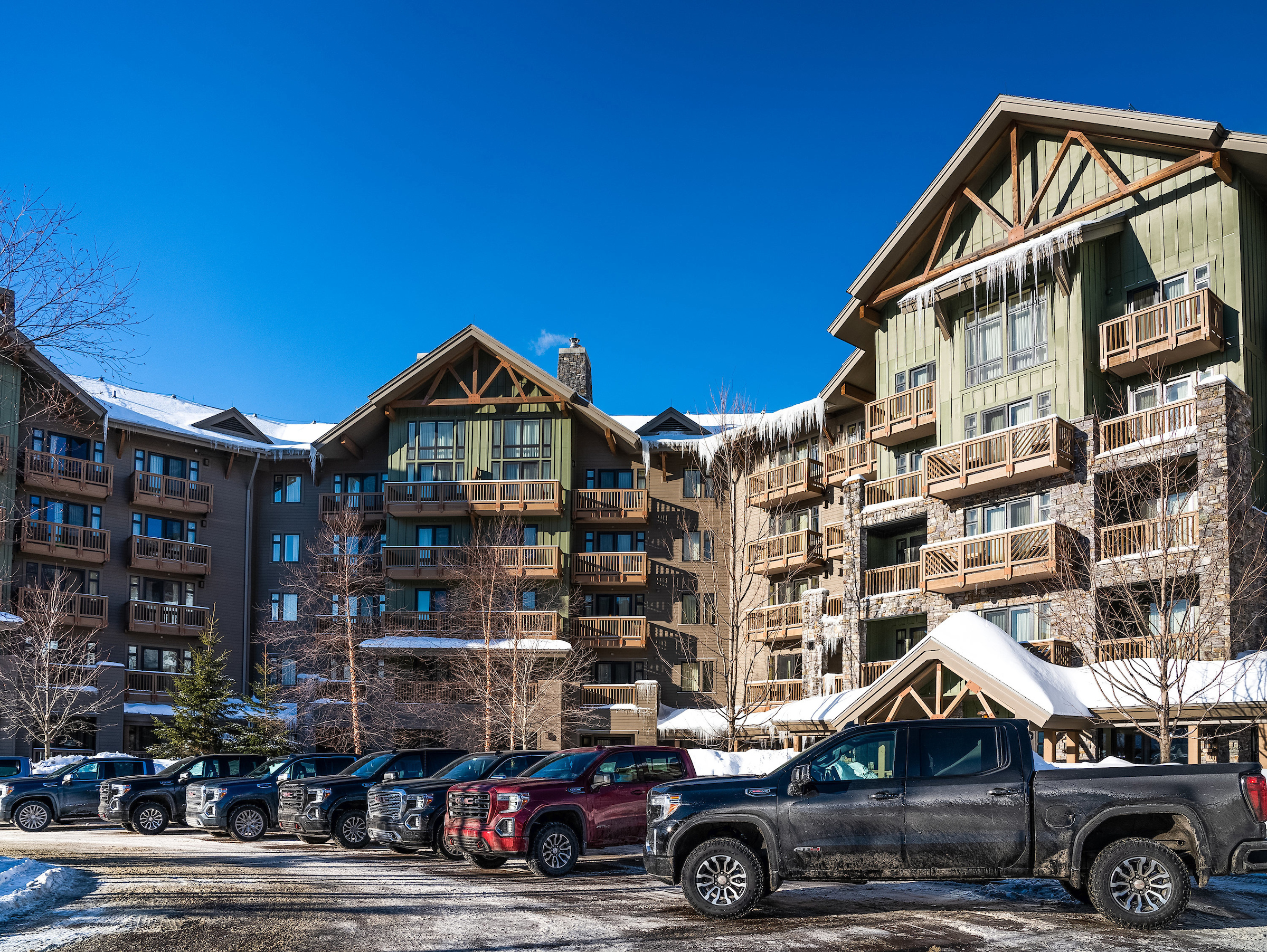 GMC vehicles in front of a Stowe resort hotel