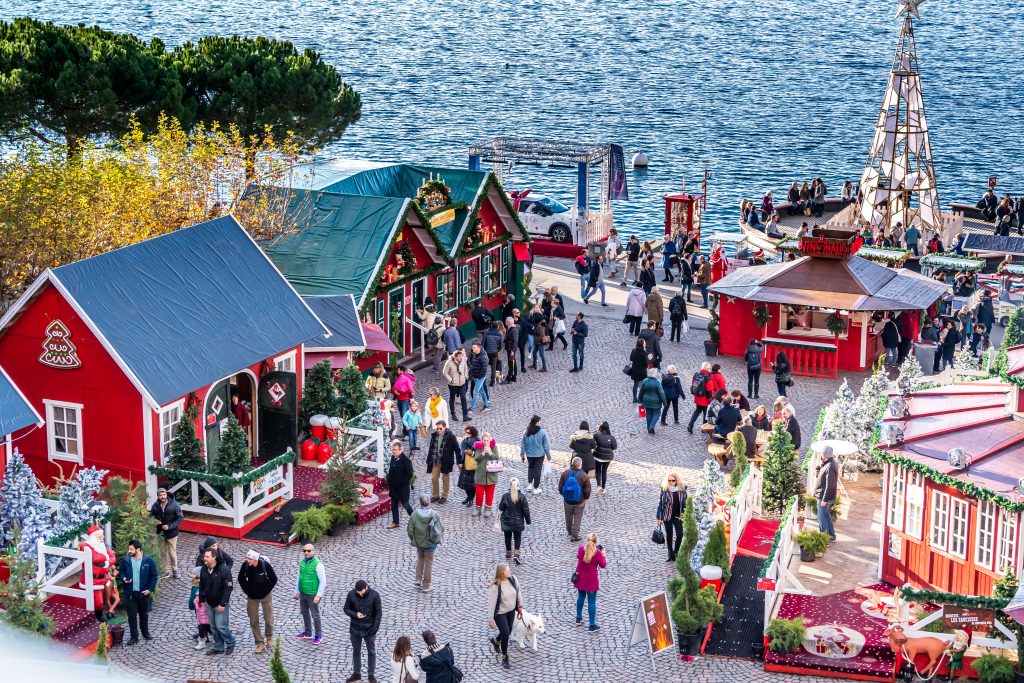 A European Christmas market on the shore of Lake Geneva.