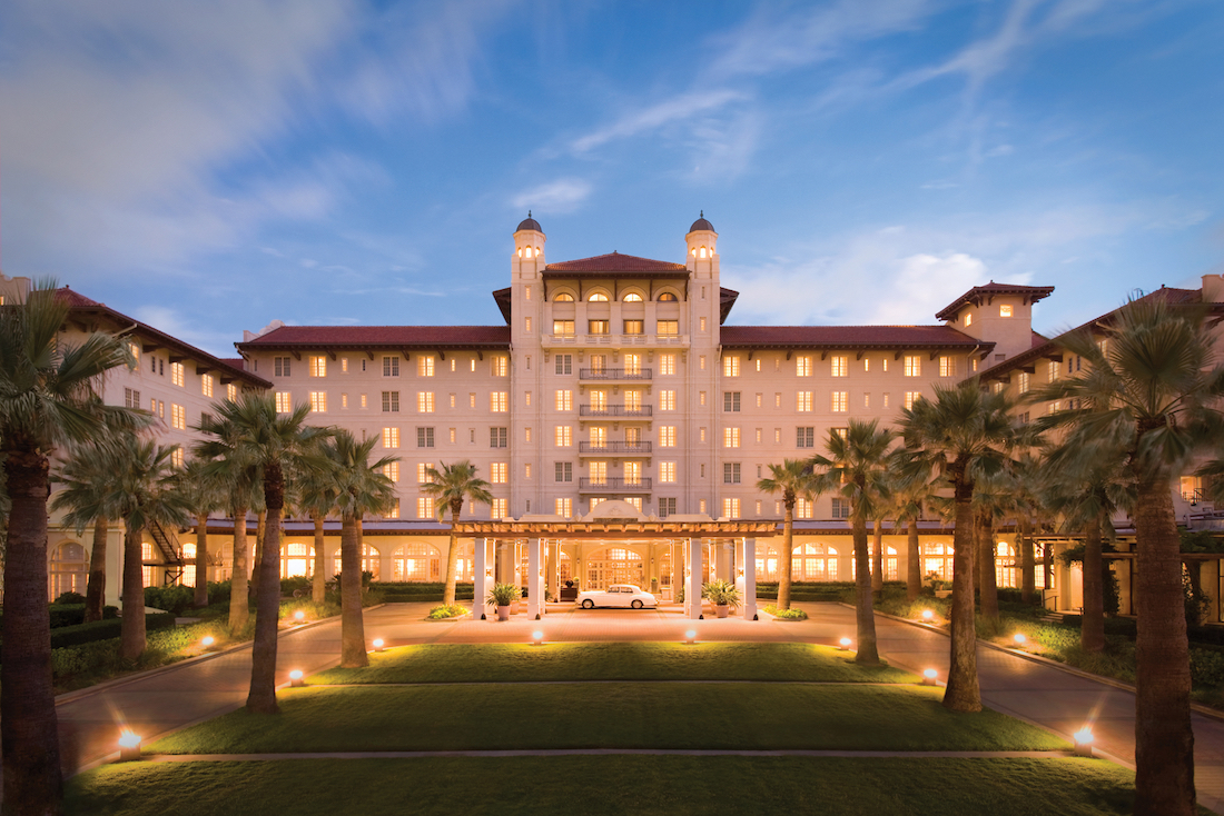 hotel galvez lit up at night near the port of Galveston perfect location for a cruise out of galveston