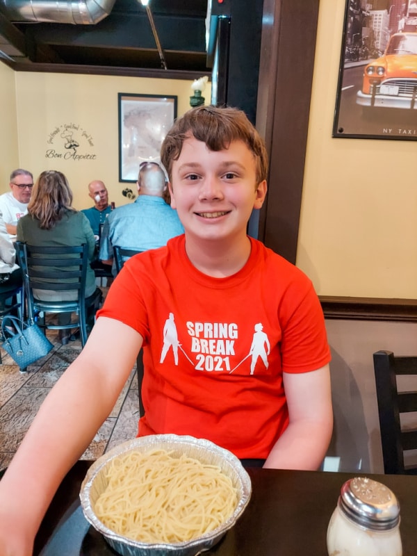 Boy with pasta at St. Augie’s, a budget-friendly St. Augustine restaurant