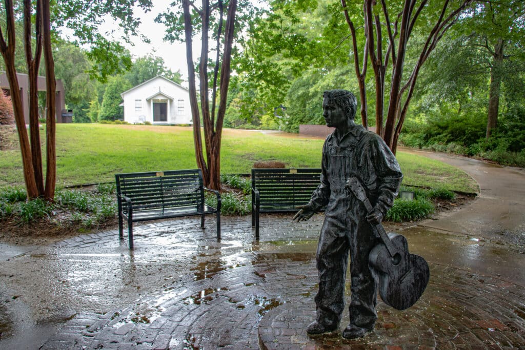 The Elvis at 13 statue in front of Elvis Presley's childhood church in Tupelo MS