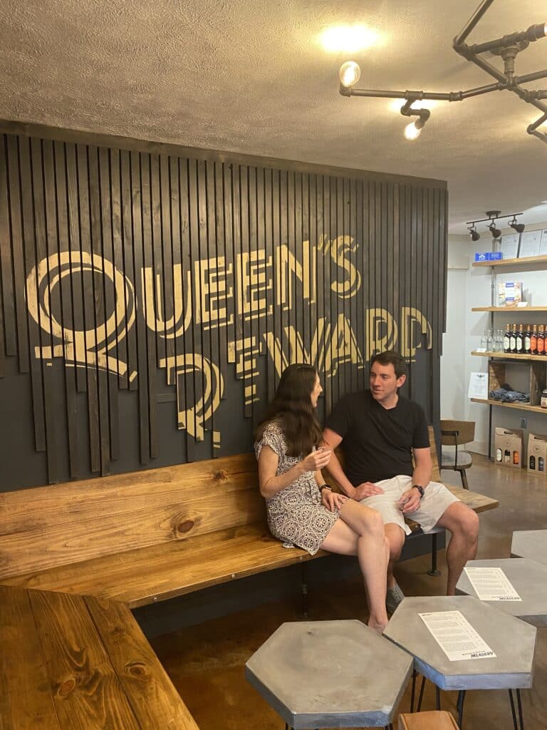 Man and woman at a mead tasting at Queen's Reward Meadery 