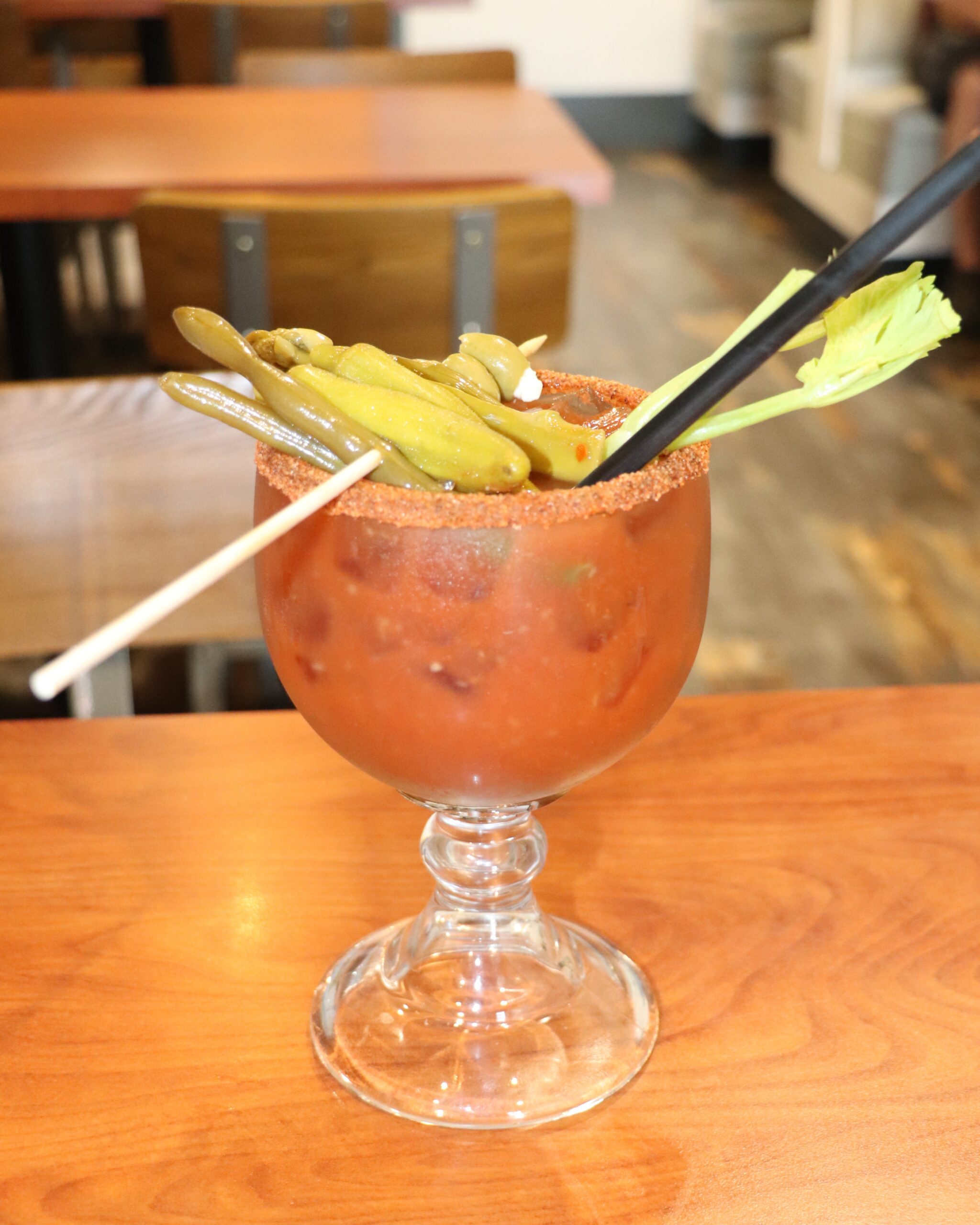 Bloody Mary in a large glass with vegetable garnishes from Brick and Spoon, a kid-friendly restaurant in Tupelo MS