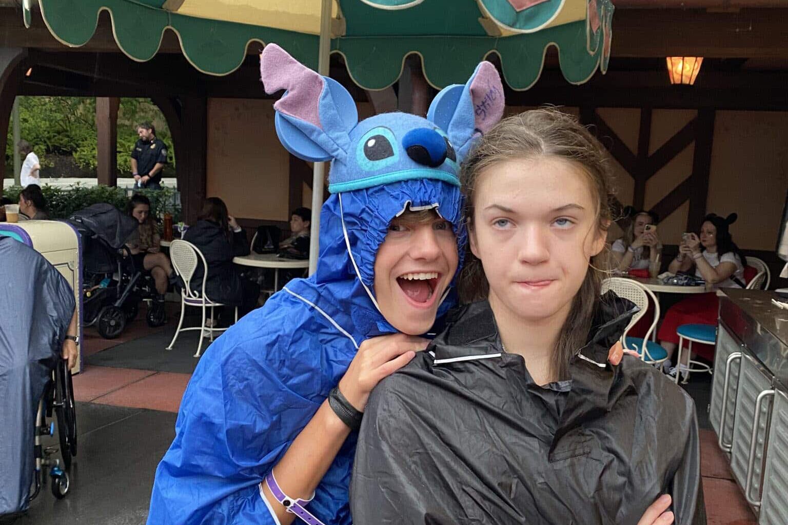 two kids prepared for rain at Disney's Not So Scary Halloween party