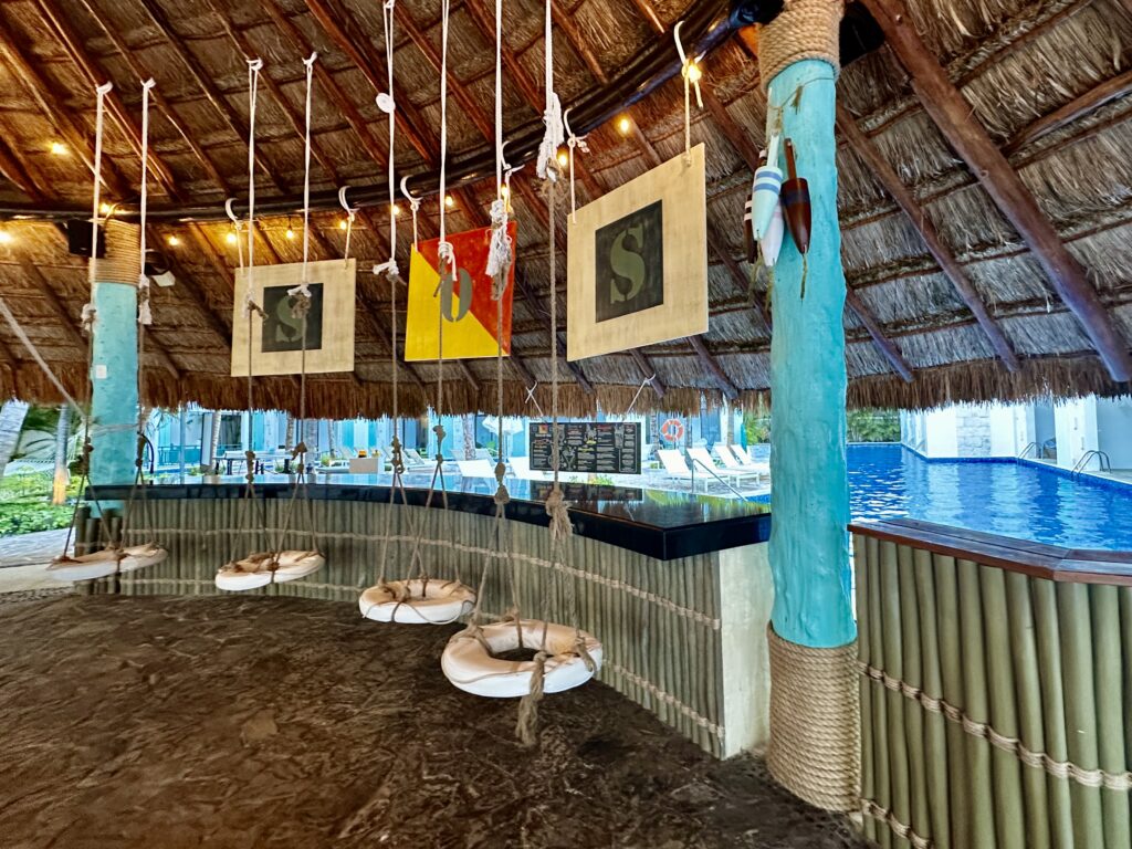 Hanging lifesaver swing seats at the SOS bar in Cancun Mexico's Margaritaville resort.