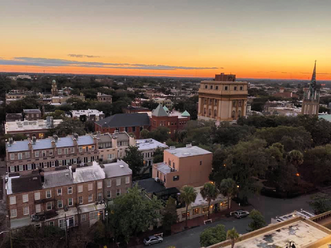 georgia-road-trips-including-savannah-sunset-over-city-from-hotel-balcony