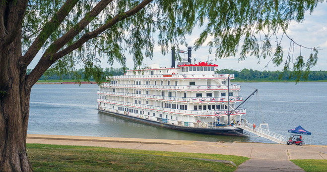 American Cruise Lines Paddlewheel boat with gangplank out to shore of Mississippi River