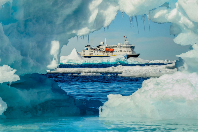 Viewing  the cruise ship through a hole in some ice.