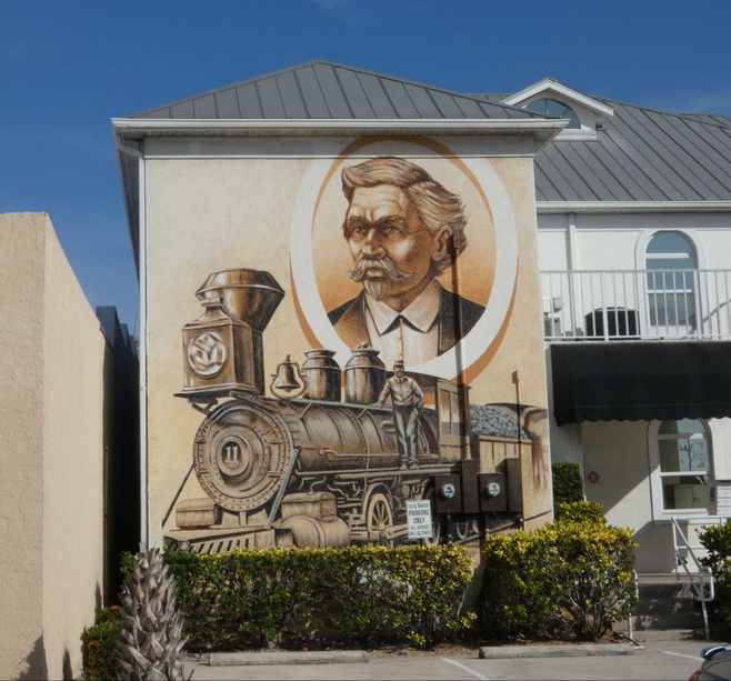 A mural of a man and a train.