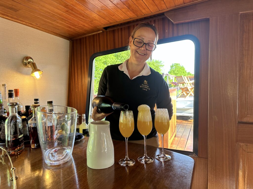 European Waterways' hostess preparing morning mimosas.