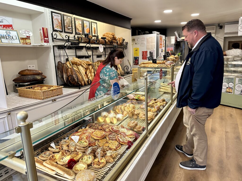 La Belle Epoque Captain choosing the daily bread at a local boulangerie.