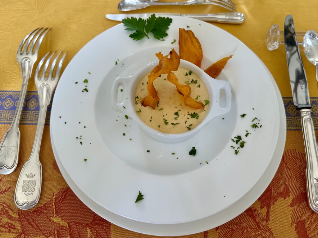 Squash panna cotta with formal place setting.