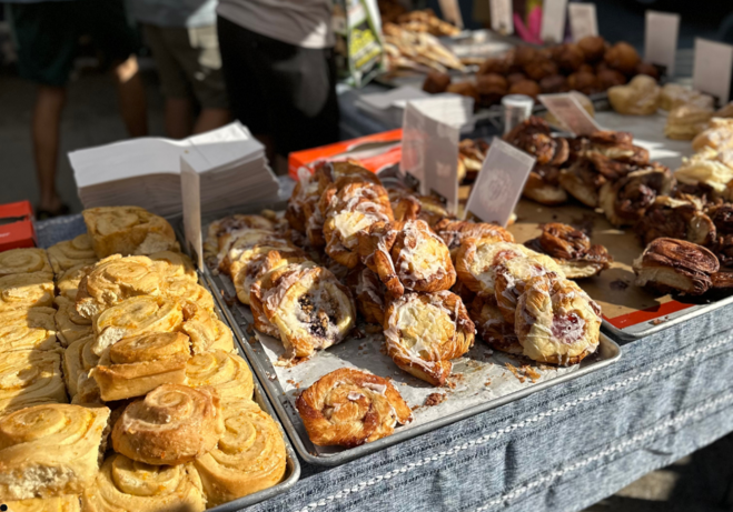An assortment of fresh baked goods displayed at a vendor booth at Pepper Place Market in Birmingham, Alabama.