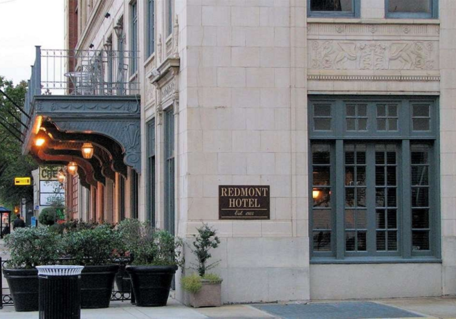 Exterior view of the historic Redmont Hotel in Birmingham, Alabama, featuring its classic brick façade.