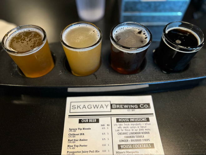 Four glasses of beer for tasting at Skagway Brewing Co.