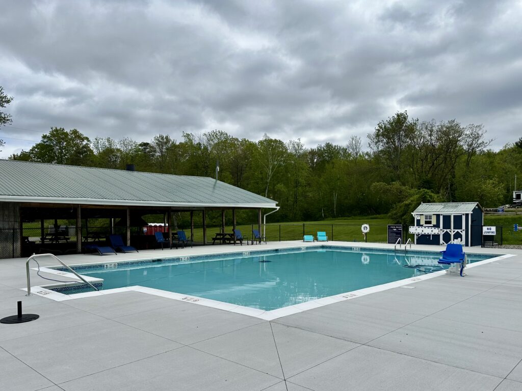 Outdoor swimming pool on a grey day at the Woodland Hills Spacious Skies campground.