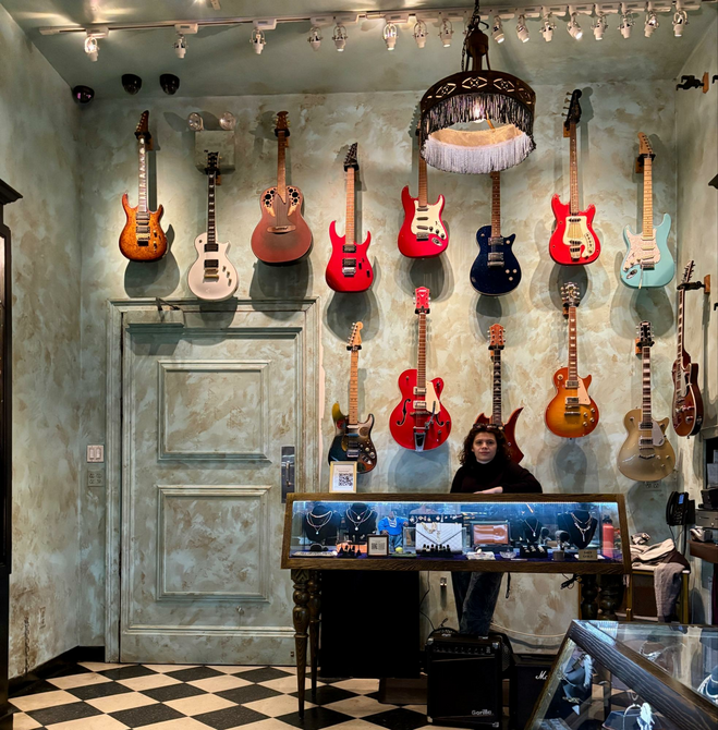 Storefront With Guitars and Jewelry For Sale