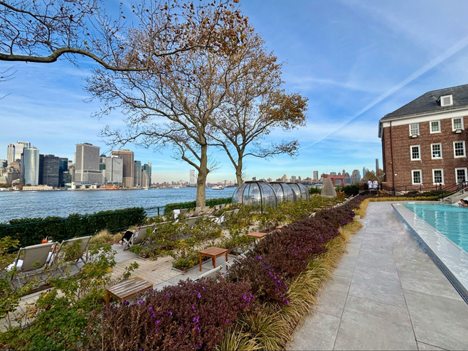 Views of Lower Manhattan by the river and near the pools at Governors Island spa