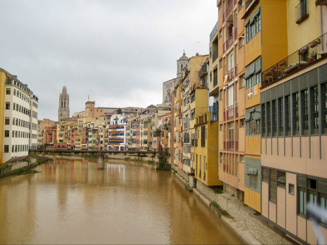 Girona’s colorful riverside buildings and ancient bridges. Photo credit: Hudson Serletic