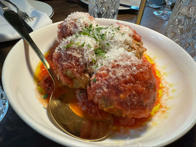 Meatballs in sauce with grated cheese
