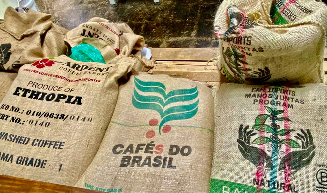 Canvas mesh, colorful bags holding coffee beans from Ethiopia, Brazil and other lands