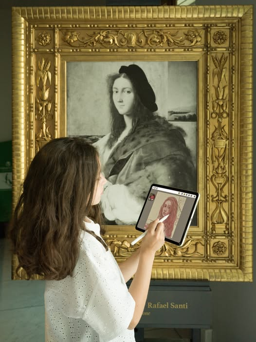 Young girl creating her self-portrait on a tablet, based on a master painter's image.