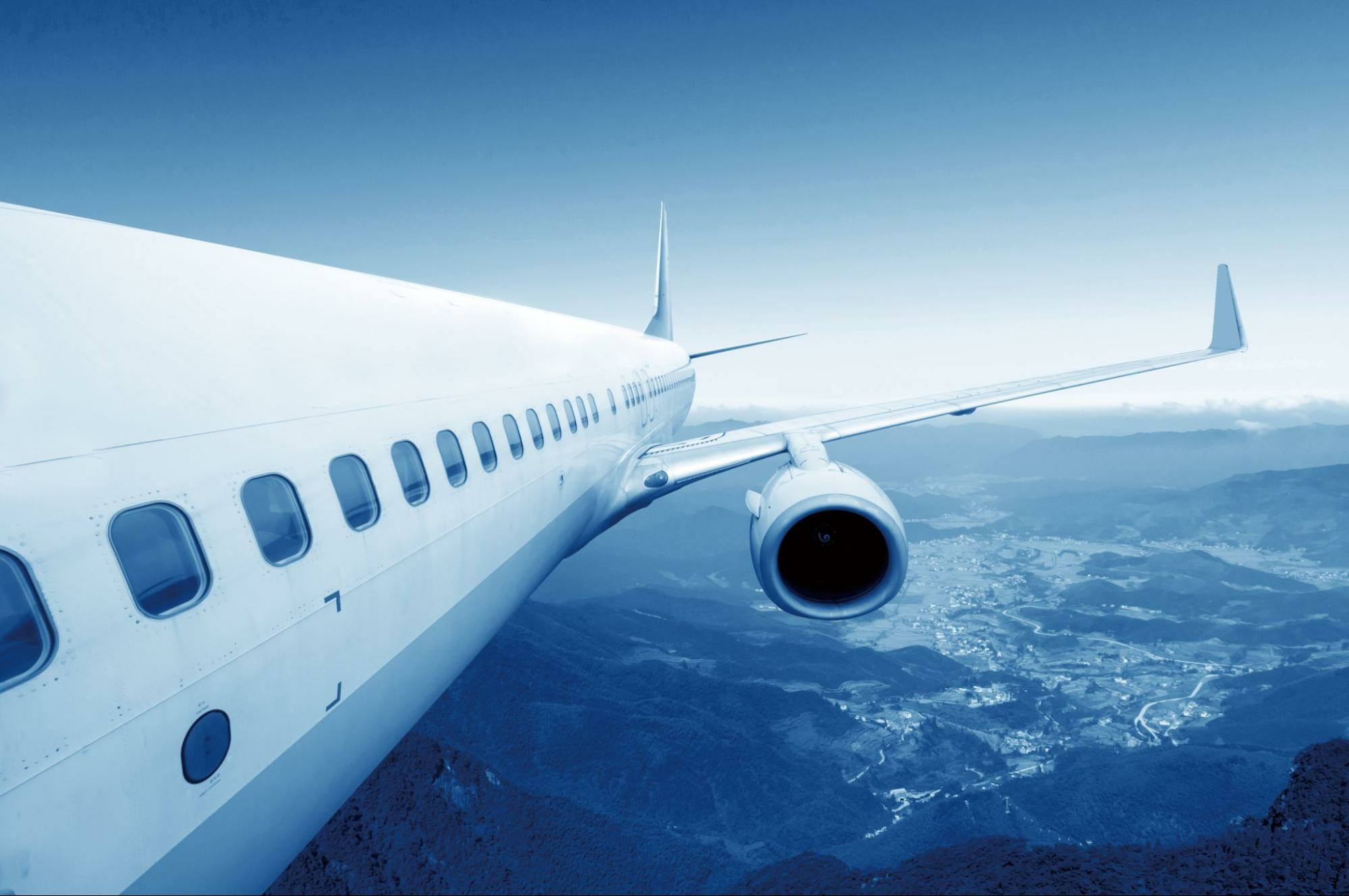 Airlplane wing against the blue sky
