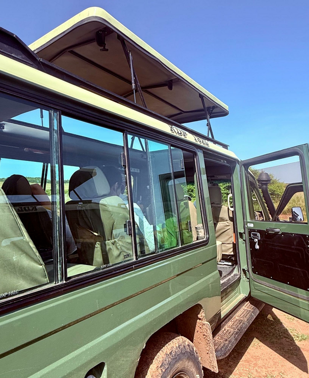 Blending into the environment is wise for game drive vehicles. Capture Kenya Expeditions chose green with narrow upper trim of khaki.