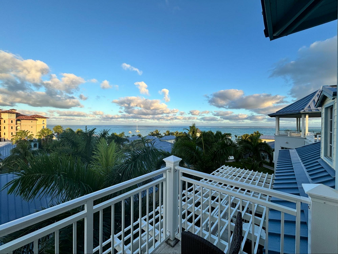 The view of the ocean with a few clouds overhead from a Beaches suite overlooking Grace Bay Beach in Turks & Caicos.