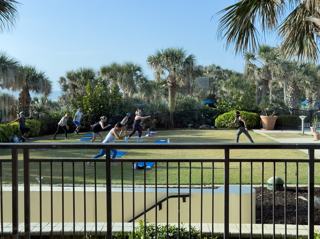 Hammock Beach Resort morning outdoor fitness class on the lawn.