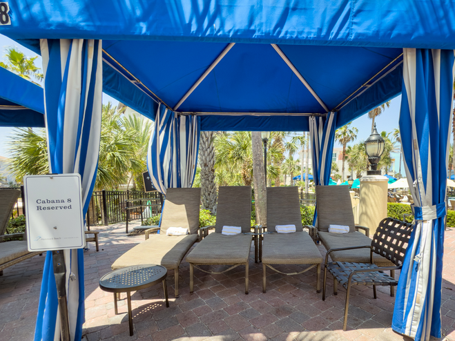 Hammock Beach Resort reserved blue and white cabana by the pool.