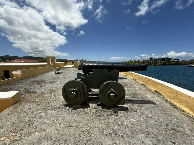 Cannons on the roof of Historic Fort with the ocean in the distance