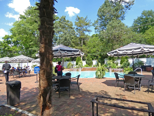 Swimming pool with tables and umbrellas