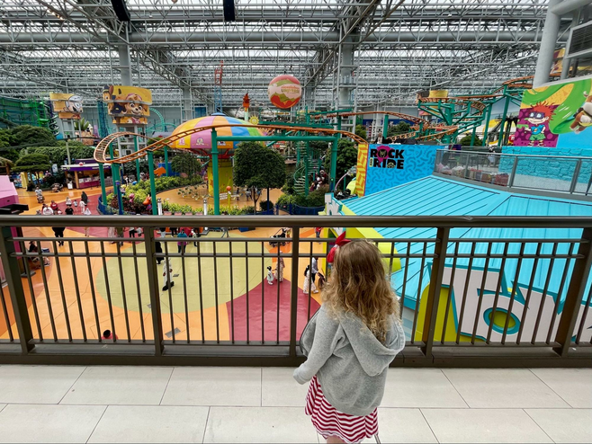 Girl overlooks the rides at Nickelodeon Universe at Mall of America