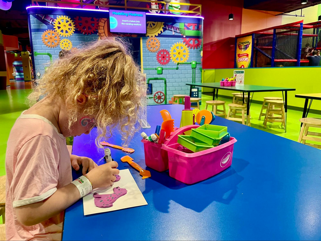 Girl colors and creates at Crayola Experience at Mall of America