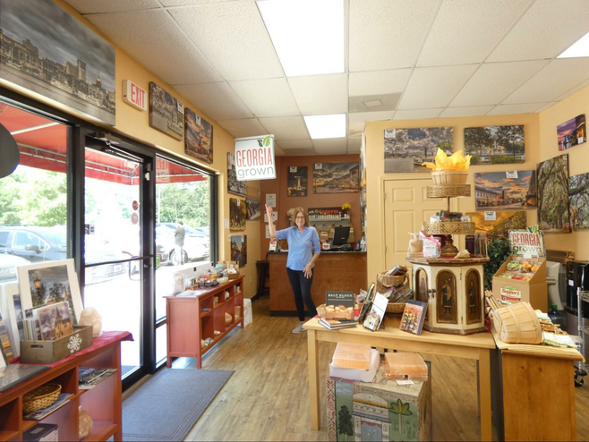 A woman at store with spices on display.