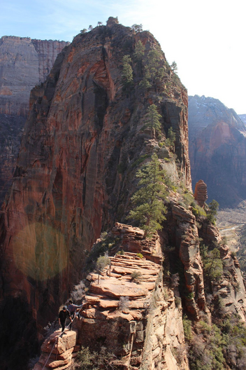 View of a narrow rock ridge leading out to trail summit.