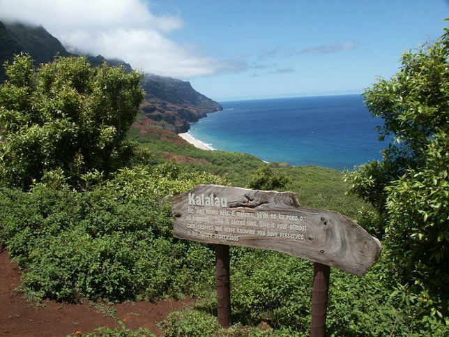 Kalalau sign on trail overlooking coast