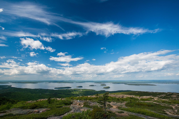 A view of islands and a bay from a mountain summit