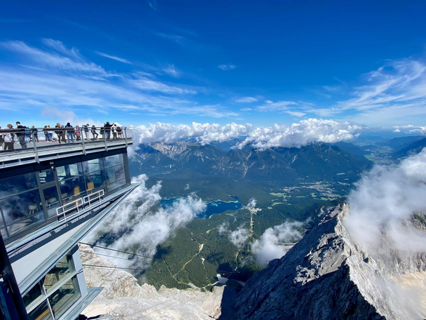 Overlooking a mountain valley from the top of a gondola station.