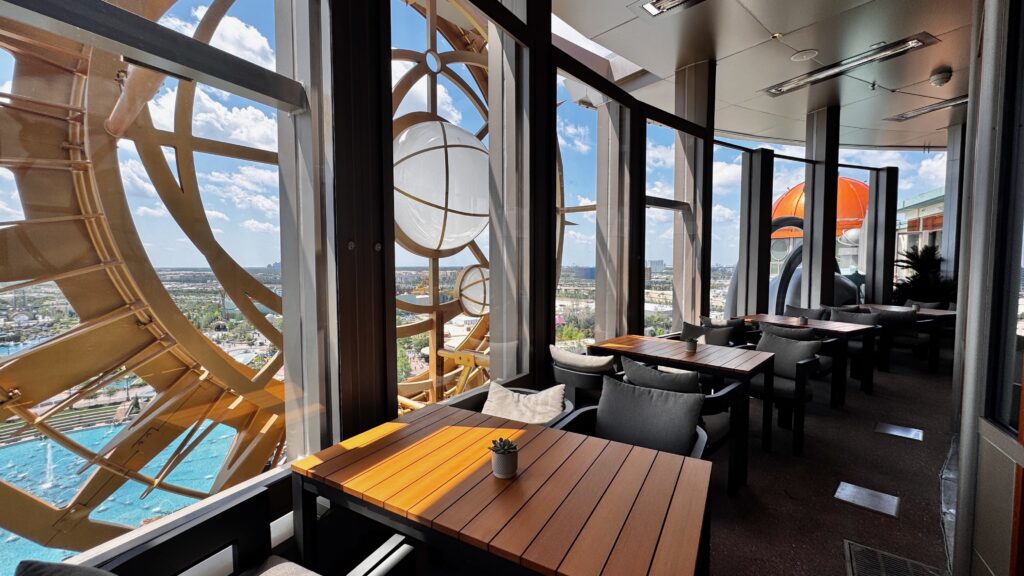 Bright colorful view of Epic Universe from the rooftop bar in the Helios Resort.