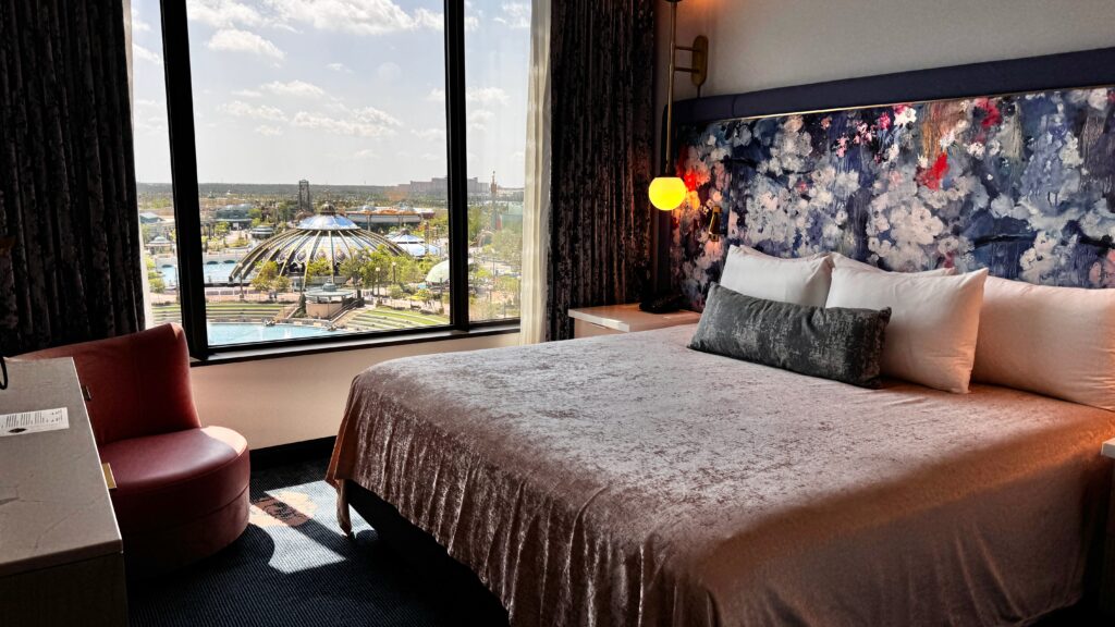 King suite, soft floral tones, velvety textures, and amazing view of Epic Universe.
