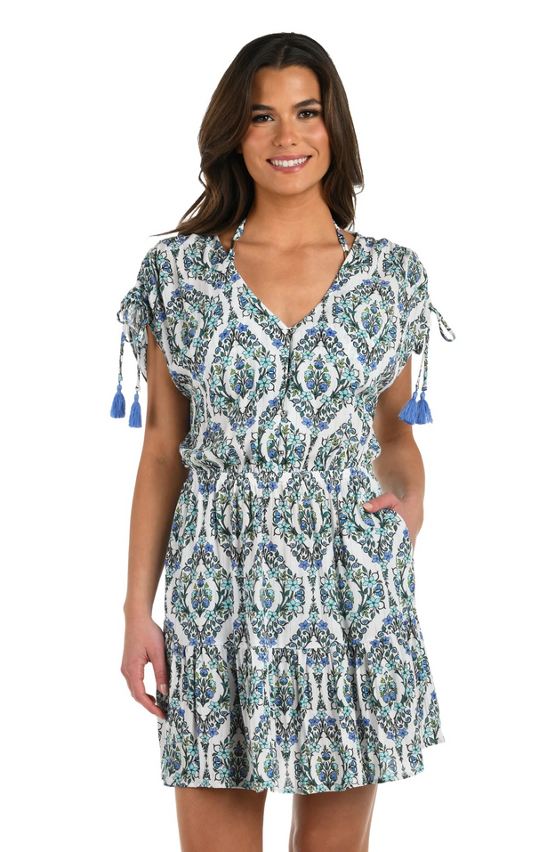Smiling woman wearing a blue beach coverup