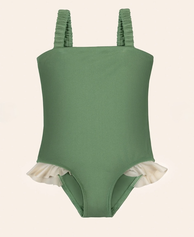 Green one-piece swimsuit with ivory ruffle trim at leg openings