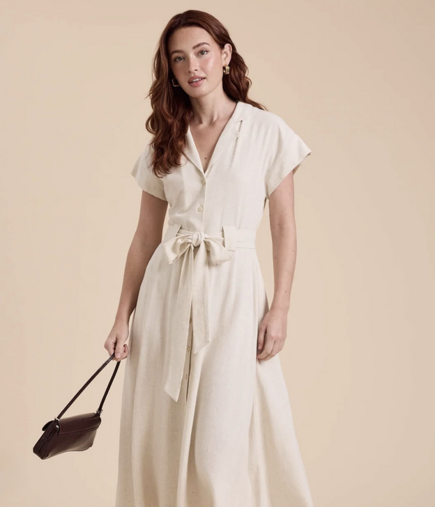 Woman wearing cream colored v-neck shirtdress from Vickie's Gifts